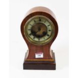 An early 20th century French walnut cased balloon 8-day mantel clock, the enamel chapter ring