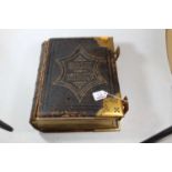 A table top brass and leather bound Holy Bible