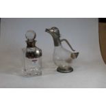 A modern cut glass decanter and stopper, having silver collar, with silver decanter label for