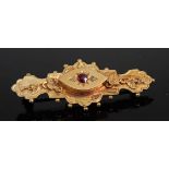 An early 20th century 9ct gold ruby and diamond point set bar brooch, 3.4g, 4.5cm