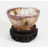 A blue john style polished hardstone bowl, standing on a circular foot, dia. 12cm, standing on an