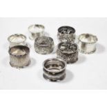 Eight various silver napkin rings, to include embossed examples and three engraved examples, various