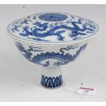 A Chinese export blue & white stem cup and cover, underglazed blue decorated with dragons amidst