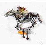 A 20th century chrome and hand painted car mascot, in the form of a race horse and jockey, length