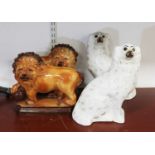 A pair of Staffordshire style models of spaniels, height 35cm (a/f), together with a pair of similar