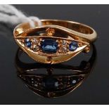 A George V 18ct gold, sapphire and diamond ring, as an elliptical setting, the stones being pavé