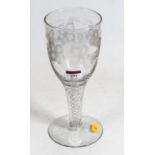 A large glass goblet, etched with fruiting vines, on a double opaque airtwist stem to domed footrim,