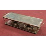 An early 20th century hammered copper and brass mounted warmer, of typical rectangular form and