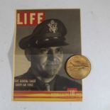 An Air Force medal and Life cover