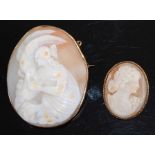 A carved shell cameo brooch depicting three-quarter length profile portrait of a maiden feeding a