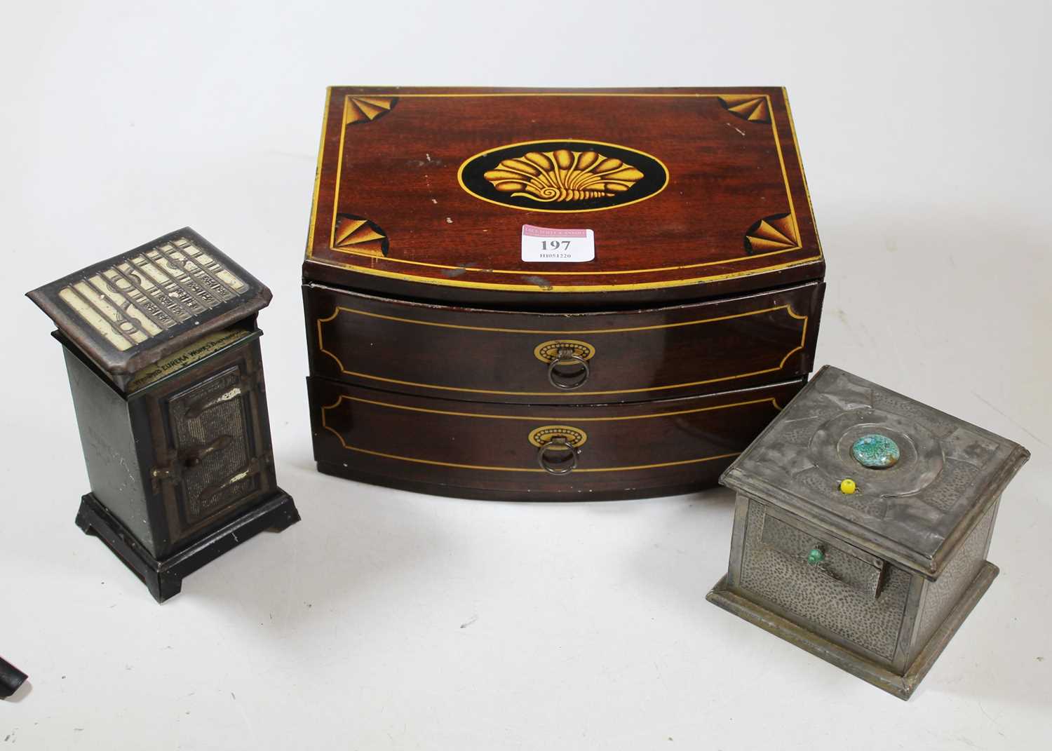 An early 20th century British tinplate Eureka money-box in the form of a safe, h.13.5cm; together