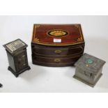 An early 20th century British tinplate Eureka money-box in the form of a safe, h.13.5cm; together