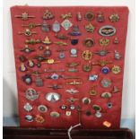 A collection of various assorted military and other sweetheart brooches, lapel badges, etc to