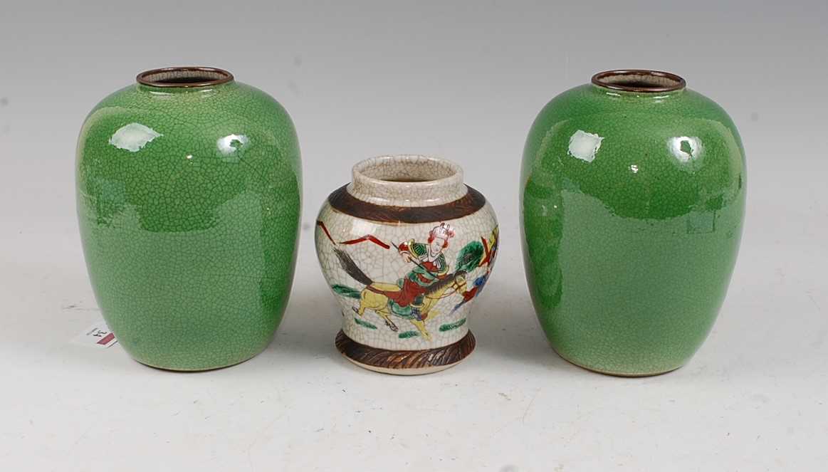 A pair of Chinese green crackle glazed vases each of ovoid form, height 17cm, together with one