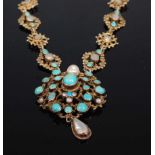 A circa 1900 gilt metal turquoise and seed pearl set pendant on integral multi link neck chain 40.