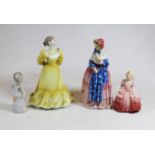 A collection of four various porcelain figures of ladies to include a Royal Doulton porcelain figure