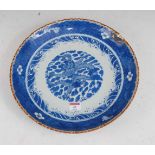 A large Chinese stoneware blue & white charger the centre glazed with a dragon amidst clouds