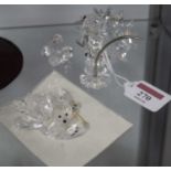 A small collection of Swarovski crystal ornaments to include cat, hedgehog and clam shell