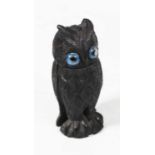 An early 20th century bog-oak scent bottle holder, carved into the form of an owl, h.10cm