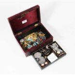 A leather clad jewellery box and contents, to include white metal and hardstone swivel pendant,