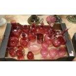 A collection of Victorian and later cranberry glass ware, to include entwined double oil bottle, a