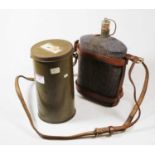 A WWII civilian gas mask in original case together with a military water bottle with leather strap