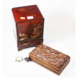 A Japanese red lacquered table top jewellery cabinet together with a carved hardwood box (2)