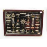 A cased set of miniature titled ships objects, case dimensions, 42 x 62cm
