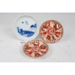 A pair of Japanese Meiji period (1868-1912) Kutani dishes, each having a central dragon within a