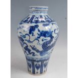 A large Chinese export stoneware Meiping vase of typical form, under-glaze blue decorated with a