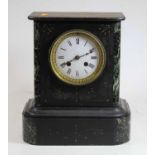 A Victorian black slate and serpentine marble 8 day mantel clock, H29cm