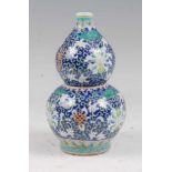 A Chinese export vase of double gourd form, enamel decorated with flowers, height 22cm