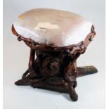 An occasional table, the large rose quartz top on a root-wood base, h.35cm