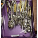 A collection of loose silver plated flatware, mainly being salad servers, pickle forks etc