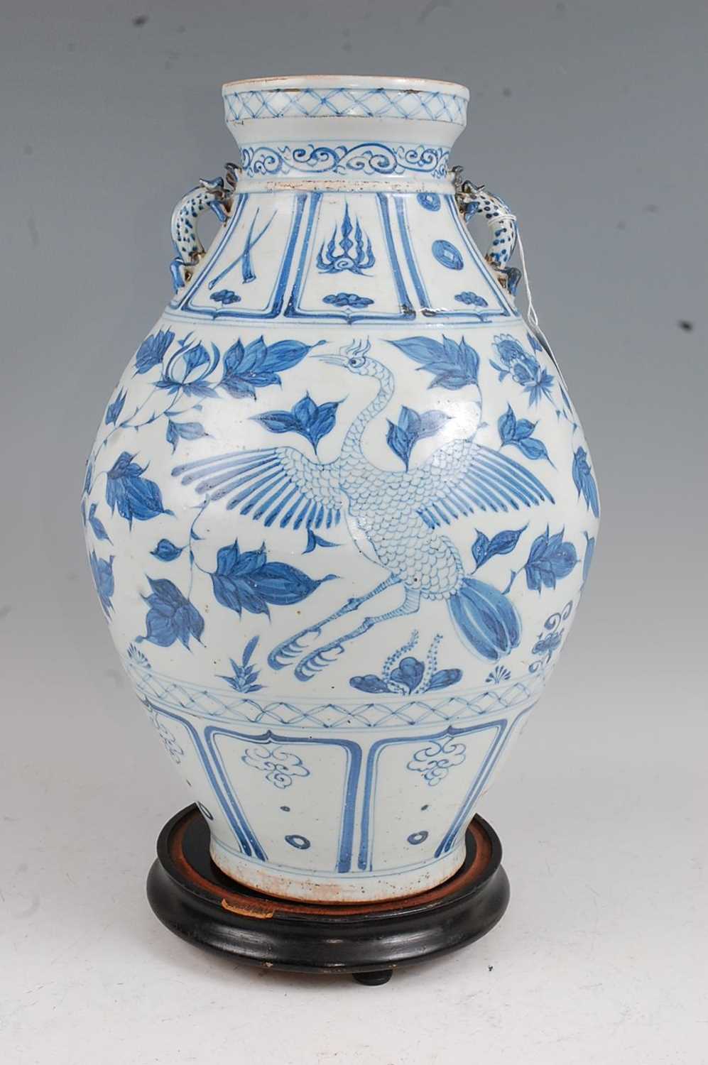 A large Chinese export blue & white vase having a flared rim to a bulbous lower body decorated