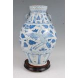 A large Chinese export blue & white vase having a flared rim to a bulbous lower body decorated