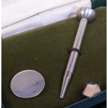 A cased silver golfing tee and marker, maker WM, modern Birmingham assays