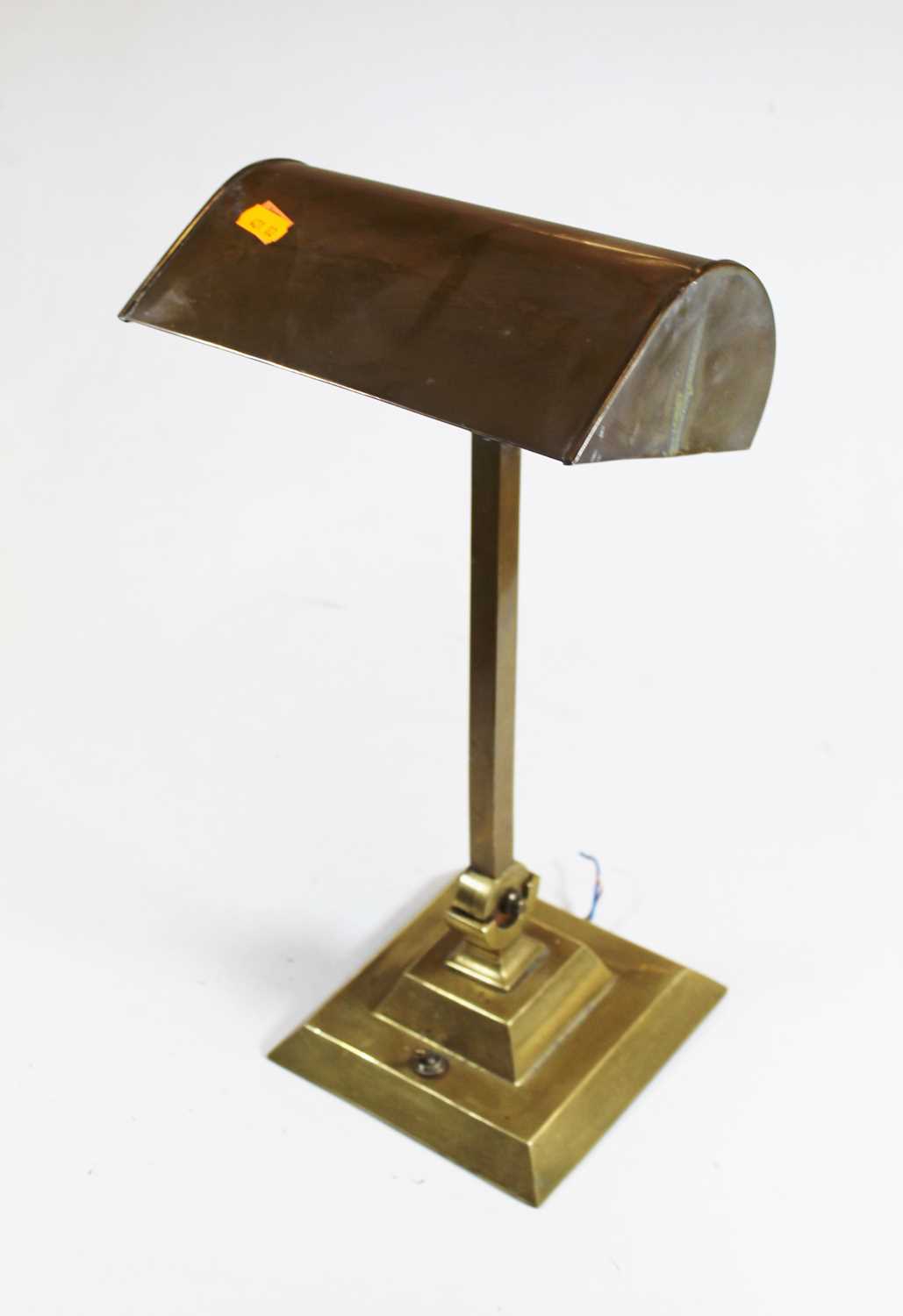 A 1930s American brass adjustable desk lamp, height 44cmCondition report: Adjusts and holds firm.