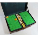 A 20th century plastic mah jong set, housed in a tan leather caseCondition report: 144 pieces.