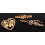 A 15ct gold and ruby set bar brooch, 2.3g, 36mm; together with an Edwardian 9ct gold, blue topaz and