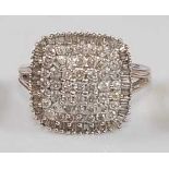 A 9ct white gold diamond square cluster ring, featuring 45 round brilliant cut diamonds and 56
