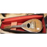 An early 20th century Italian rosewood and mother of pearl inlaid mandolin, bearing label for