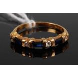 An 18ct gold, sapphire and diamond half hoop ring, the baguette cut sapphires each flanked with a