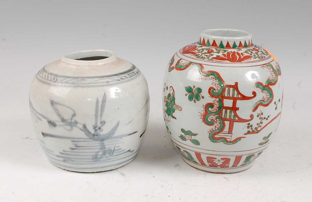 A Chinese blue & white ginger jar of squat baluster form typically decorated with a landscape (