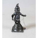 An early 20th century cast metal bar top cigar lighter in the form of Mr Punch, having a feather