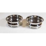A pair of 20th century silver plated wine coasters, with gadrooned rim, dia. 17cm