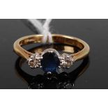 An 18ct gold and platinum, sapphire and diamond three-stone ring, total diamond weight estimated