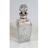 A modern cut glass decanter and stopper, having silver collar, h.29cm