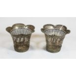 A pair of early 20th century white metal baskets, each having a shaped rim and pierced lower body,