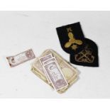 Two gold braid embroidered naval cloth badges; together with various banknotes to include Government